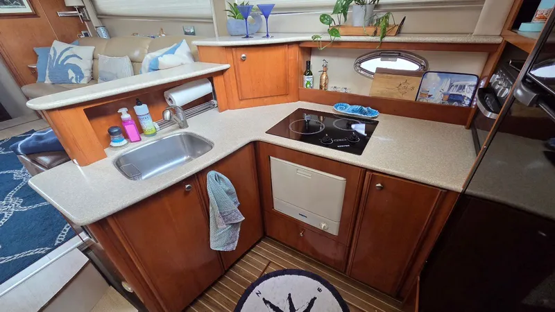 Slide: The Image of 2004 Meridian 459 Motoryacht kitchen with sink and stove. - 37