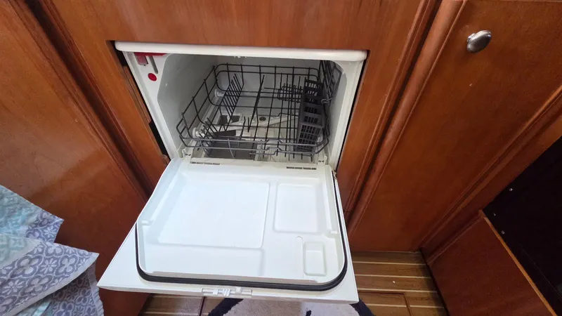 Slide: The Image of Open dishwasher in a 2004 Meridian 459 Motoryacht. - 38