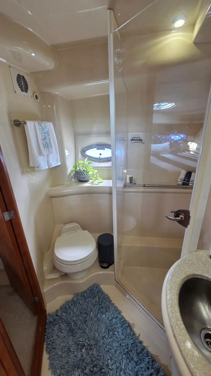 Slide: The Image of 2004 Meridian 459 Motoryacht bathroom with shower and toilet. - 43