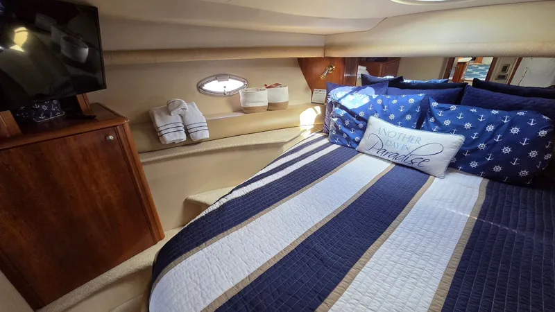 Slide: The Image of Luxurious cabin of 2004 Meridian 459 Motoryacht with nautical bedding. - 48