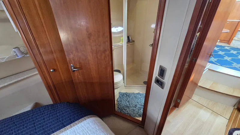 Slide: The Image of Interior of 2004 Meridian 459 Motoryacht with bathroom and wooden doors. - 49