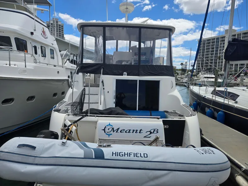 Slide: The Image of 2004 Meridian 459 Motoryacht docked with dinghy. - 5