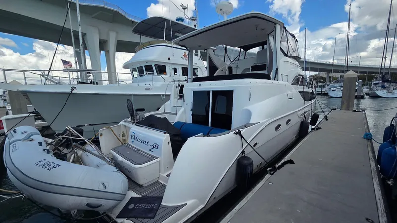 Slide: The Image of 2004 Meridian 459 Motoryacht docked with inflatable boat. - 8