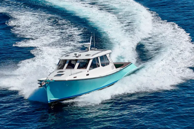 Slide: The Image of 2007 True North 38 yacht cruising on open blue waters. - 11