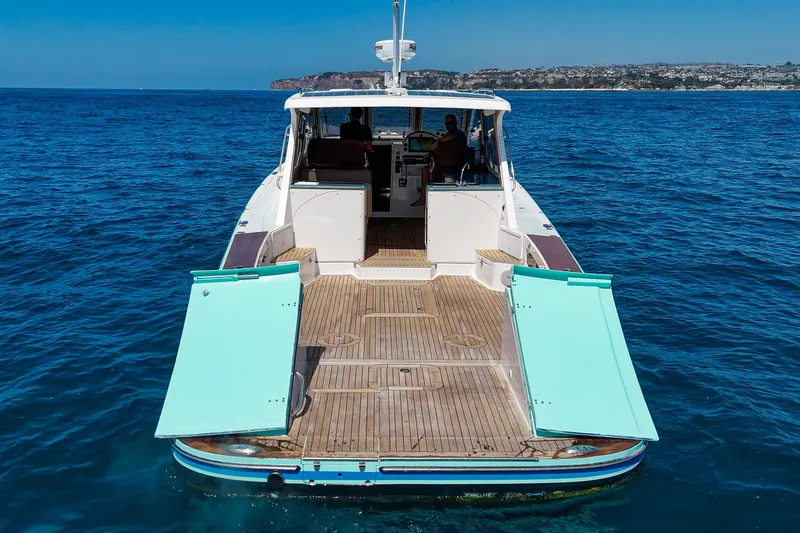 Slide: The Image of 2007 True North 38 boat cruising on open blue water. - 12