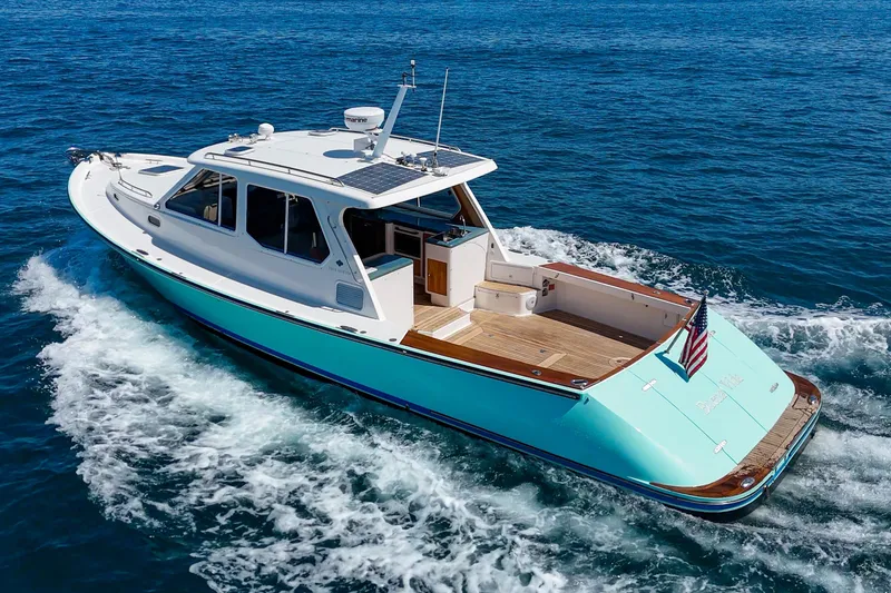 Slide: The Image of 2007 True North 38 yacht cruising on open blue waters. - 13