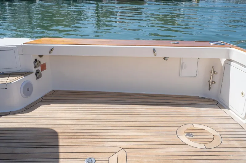Slide: The Image of Spacious deck of a 2007 True North 38 boat with wooden flooring. - 17