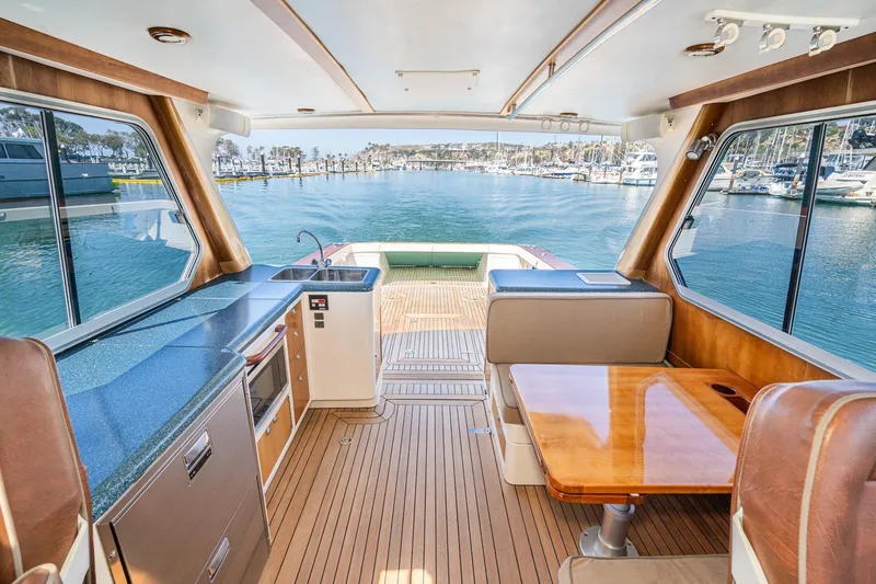 Slide: The Image of Luxurious 2007 True North 38 yacht interior with wood finishes and marina view. - 26