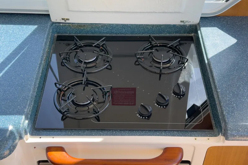 Slide: The Image of Three-burner stove on 2007 True North 38 yacht, set in a sleek countertop. - 29