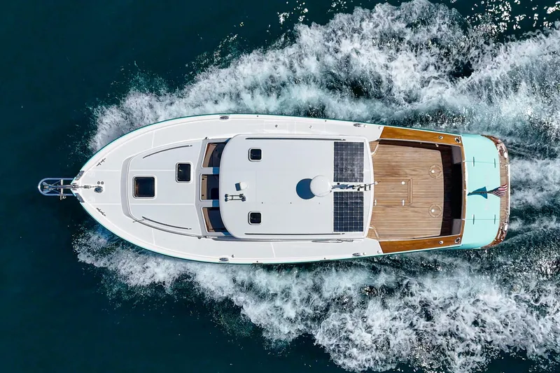 Slide: The Image of Aerial view of 2007 True North 38 yacht cruising on open water. - 3