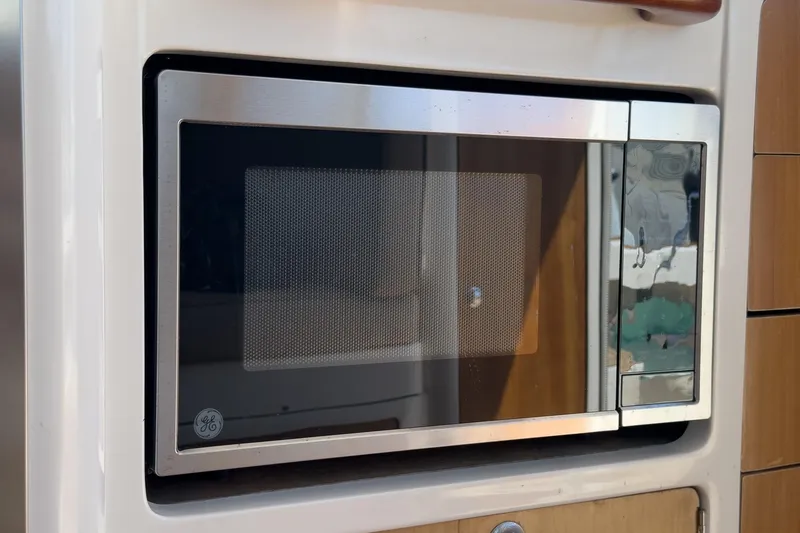 Slide: The Image of Built-in GE microwave in a 2007 True North 38 yacht kitchen. - 30