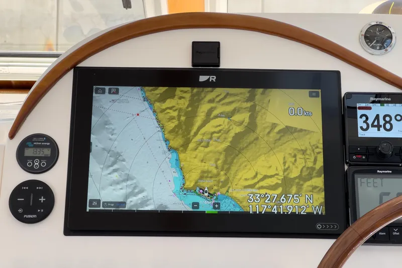 Slide: The Image of Navigation system on a 2007 True North 38 boat displaying coordinates and speed. - 36