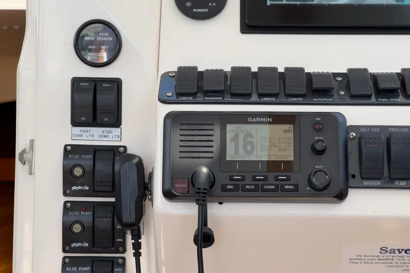 Slide: The Image of Control panel of a 2007 True North 38 boat featuring Garmin navigation system and switches. - 38