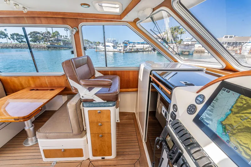 Slide: The Image of Interior of 2007 True North 38 boat with helm, seating, and navigation display. - 41