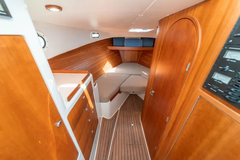 Slide: The Image of Luxurious 2007 True North 38 yacht interior with wooden cabinetry and cozy sleeping area. - 43