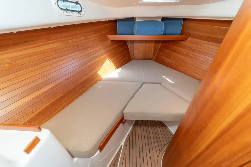 Slide: The Image of Cozy cabin interior of 2007 True North 38 boat with wooden paneling and cushioned seating. - 45