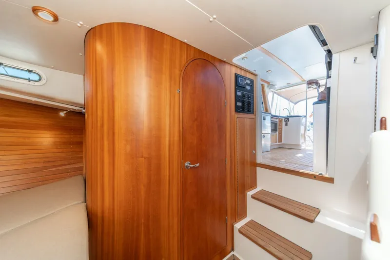 Slide: The Image of Interior of 2007 True North 38 yacht with wooden paneling and steps to cockpit. - 46