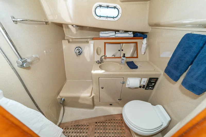 Slide: The Image of Luxurious 2007 True North 38 yacht bathroom with shower, sink, and toilet. - 48