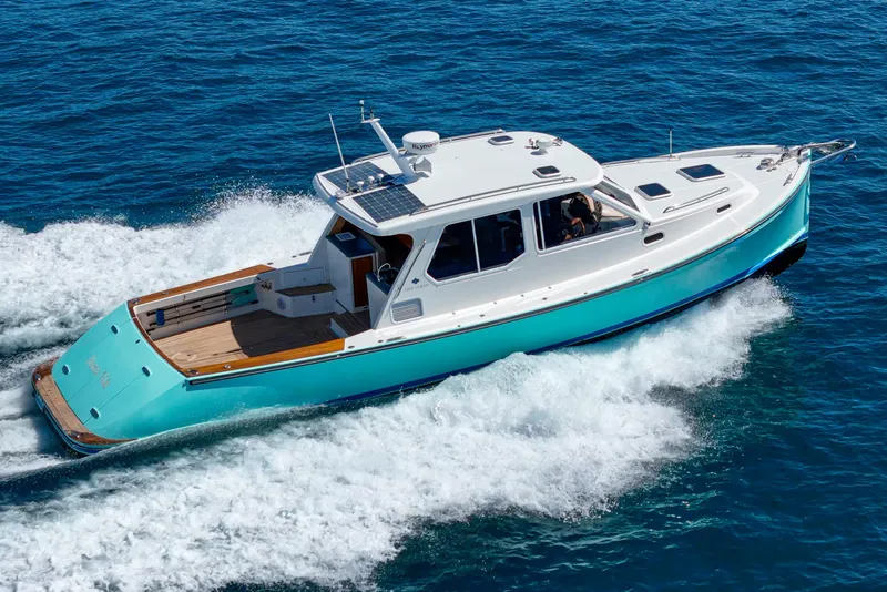 Slide: The Image of 2007 True North 38 boat cruising on blue ocean waters. - 5