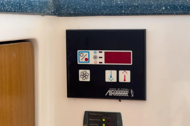 Slide: The Image of Control panel of a 2007 True North 38 boat, featuring temperature and fan settings. - 52