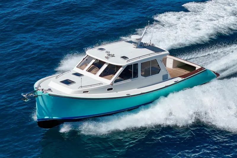 Slide: The Image of 2007 True North 38 yacht cruising on open blue ocean waters. - 9