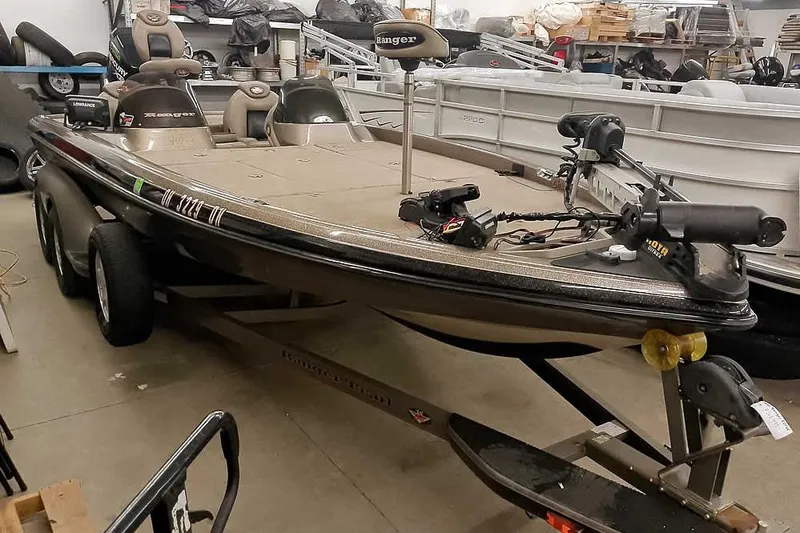 The Image of 2003 Ranger 521DVX Comanche bass boat in a storage facility. - 1