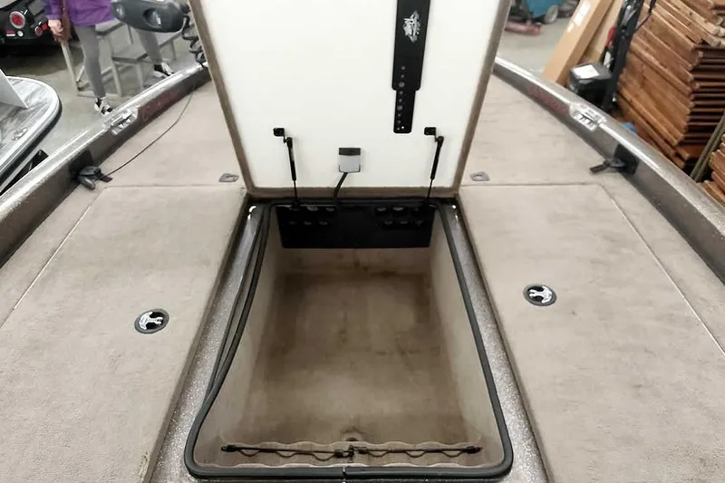 Slide: The Image of Open storage compartment on a 2003 Ranger 521DVX Comanche boat, showcasing interior space. - 15