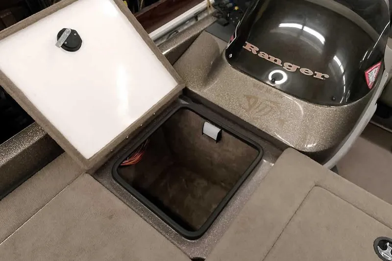 Slide: The Image of Open storage compartment on a 2003 Ranger 521DVX Comanche boat. - 16
