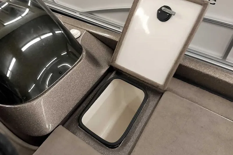 Slide: The Image of Open storage compartment on 2003 Ranger 521DVX Comanche boat interior. - 18