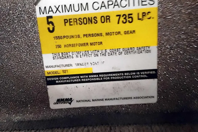 Slide: The Image of 2003 Ranger 521DVX Comanche capacity label, 5 persons, 1550 pounds, 250 horsepower motor. - 26