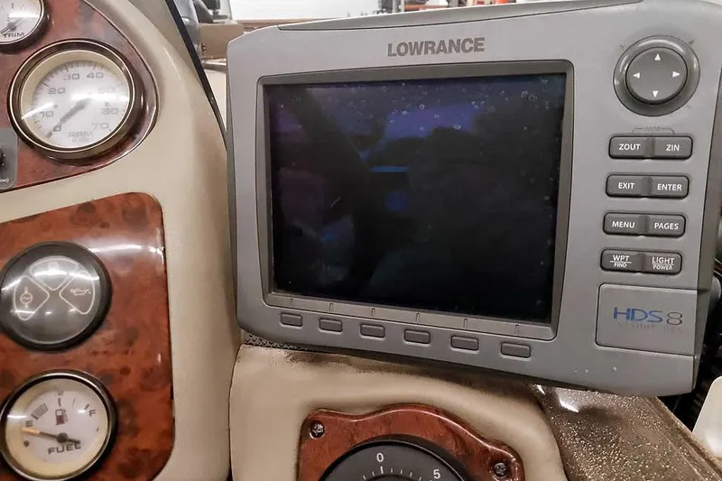 Slide: The Image of Lowrance HDS-8 fishfinder on 2003 Ranger 521DVX Comanche dashboard with gauges. - 30