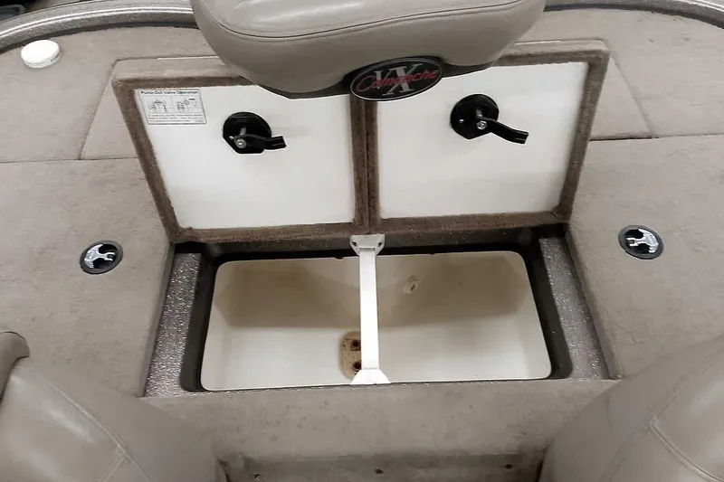 Slide: The Image of 2003 Ranger 521DVX Comanche boat storage compartment with open hatch and seating. - 33