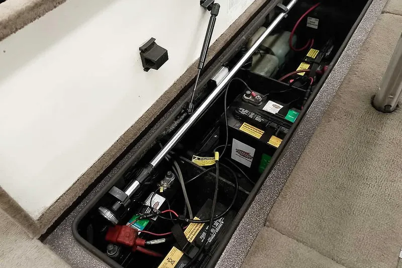 Slide: The Image of 2003 Ranger 521DVX Comanche boat battery compartment with wiring and components. - 36