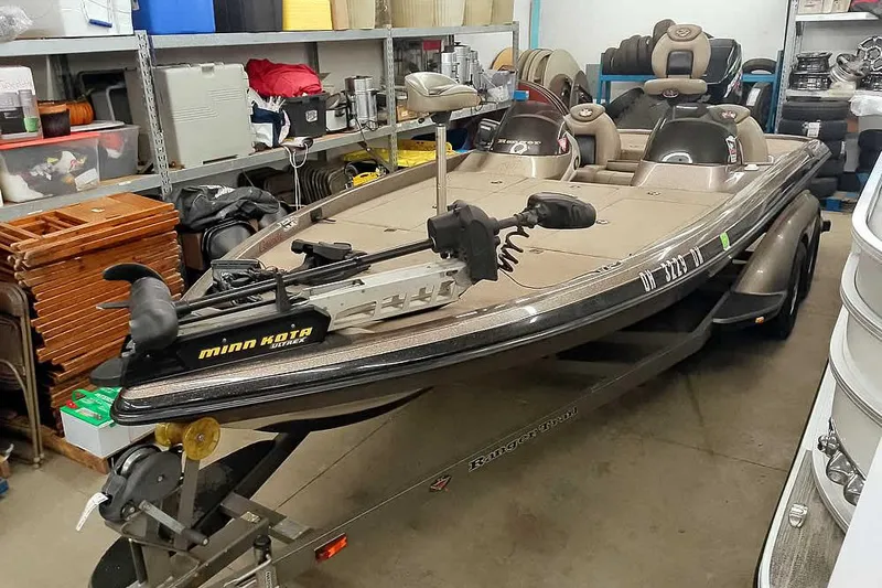Slide: The Image of 2003 Ranger 521DVX Comanche boat with Minn Kota trolling motor in storage. - 38