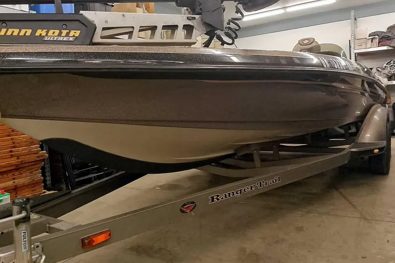 Slide: The Image of 2003 Ranger 521DVX Comanche boat on trailer in garage setting. - 7