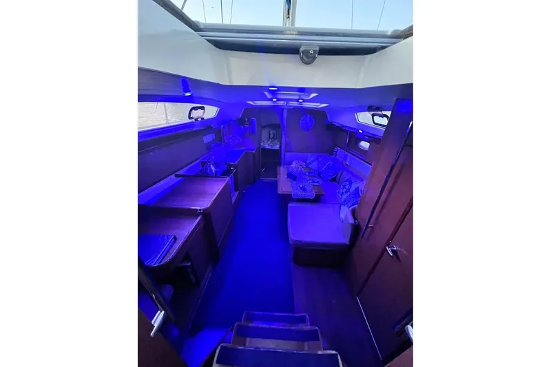 Slide: The Image of Interior of 2009 Beneteau Oceanis 40 yacht with blue ambient lighting. - 16