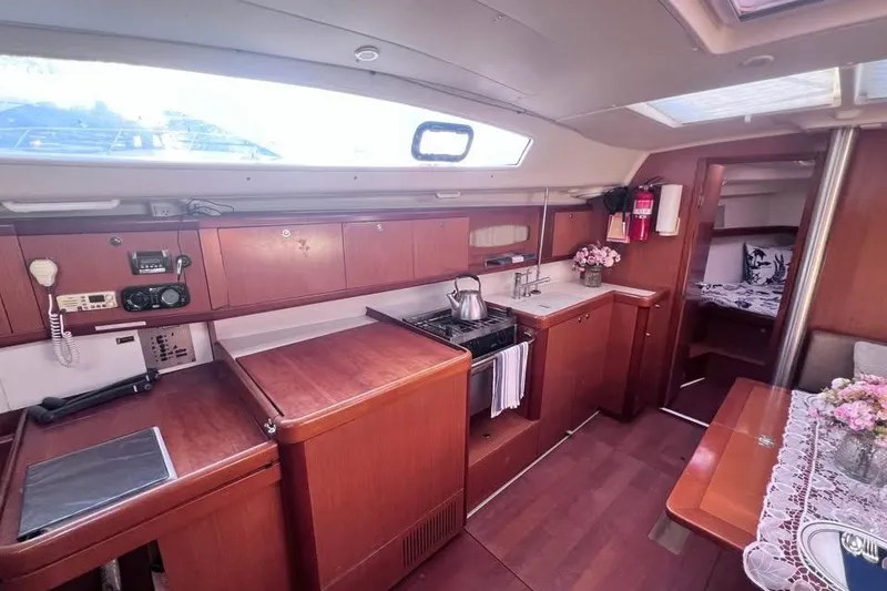 Slide: The Image of Interior of 2009 Beneteau Oceanis 40 yacht with kitchen and dining area. - 23