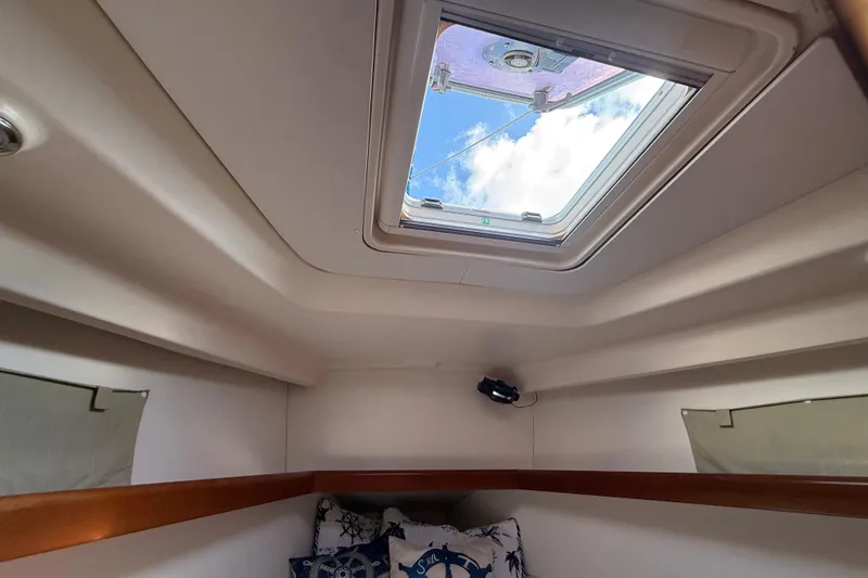 Slide: The Image of Interior cabin view of 2009 Beneteau Oceanis 40 sailboat with skylight and nautical decor. - 26