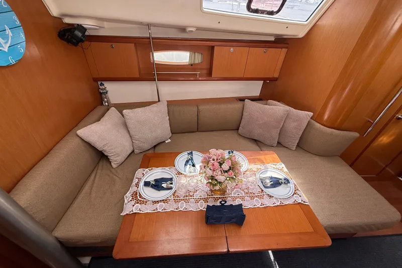 Slide: The Image of Cozy interior of 2009 Beneteau Oceanis 40 yacht with elegant dining setup. - 32