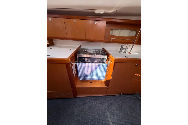 Slide: The Image of Interior of 2009 Beneteau Oceanis 40 yacht kitchen with stove and sink. - 36