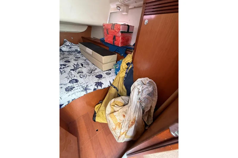 Slide: The Image of Interior cabin of 2009 Beneteau Oceanis 40 with storage and bedding. - 39