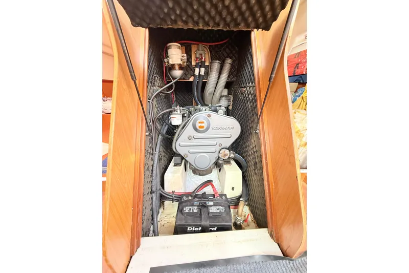 Slide: The Image of Engine compartment of a 2009 Beneteau Oceanis 40 sailboat, featuring a Yanmar engine. - 46