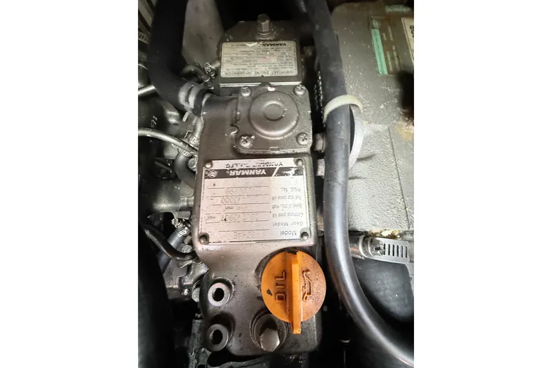 Slide: The Image of Engine compartment of a 2009 Beneteau Oceanis 40 sailboat, featuring Yanmar components. - 47