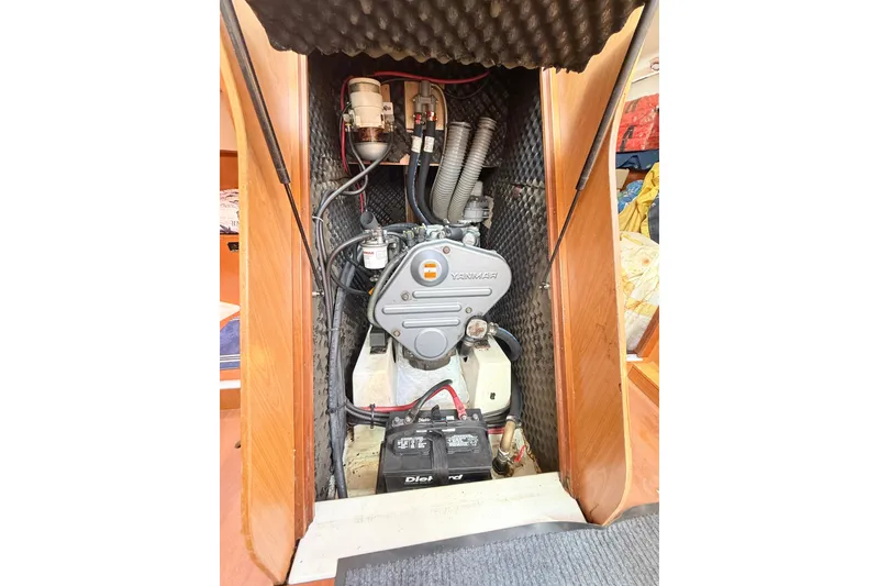 Slide: The Image of Engine compartment of a 2009 Beneteau Oceanis 40 sailboat, featuring a Yanmar engine. - 49