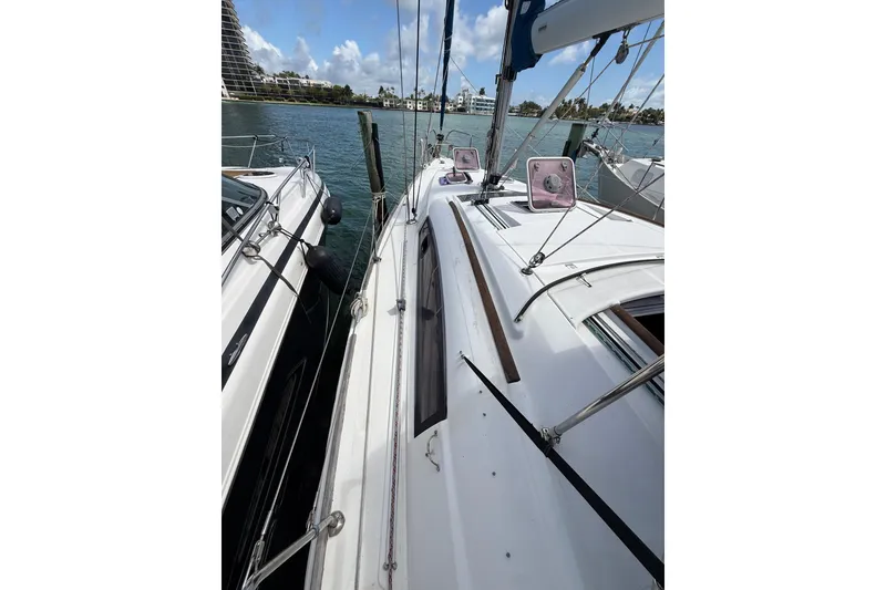 Slide: The Image of Beneteau Oceanis 40 sailboat docked, 2009 model, with clear sky and waterfront view. - 59