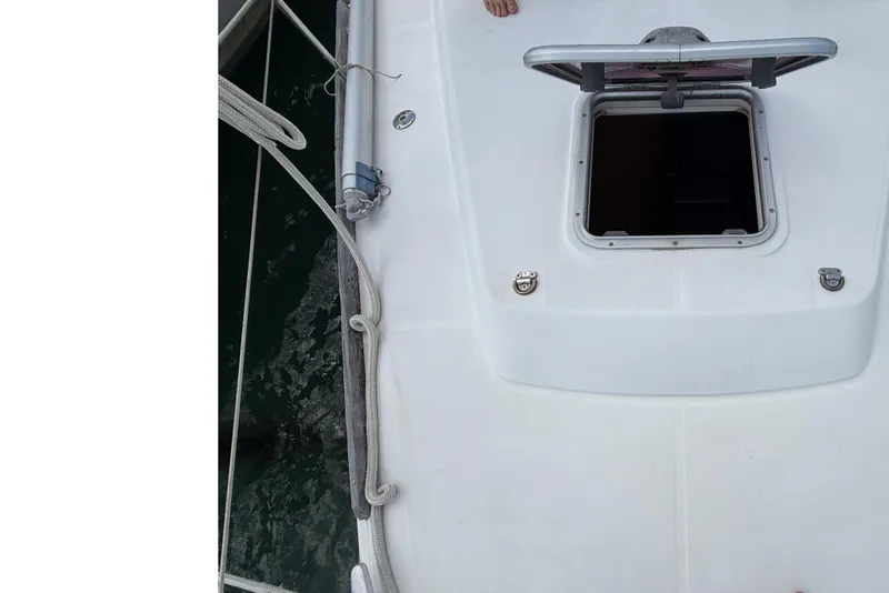 Slide: The Image of Deck view of a 2009 Beneteau Oceanis 40 sailboat with open hatch. - 64