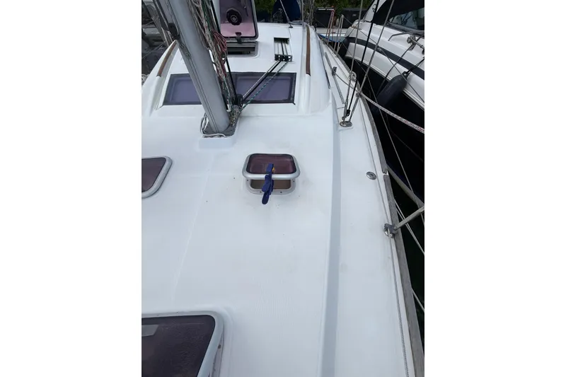 Slide: The Image of 2009 Beneteau Oceanis 40 sailboat deck with hatches and rigging. - 65
