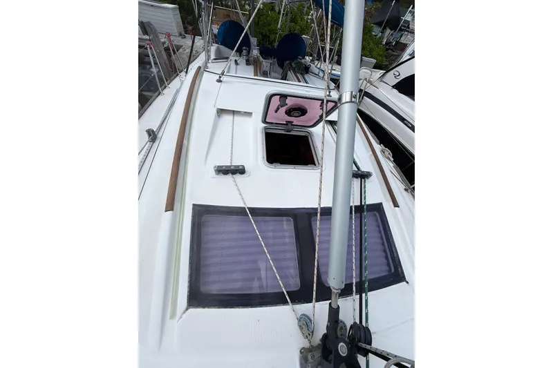 Slide: The Image of 2009 Beneteau Oceanis 40 sailboat deck with open hatch and rigging. - 68