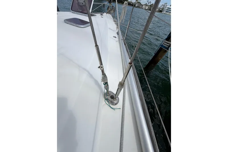 Slide: The Image of 2009 Beneteau Oceanis 40 sailboat deck with rigging details and waterfront view. - 71