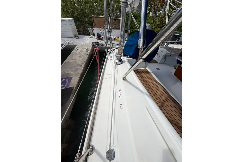 Slide: The Image of 2009 Beneteau Oceanis 40 yacht docked, showcasing deck and rigging details. - 76